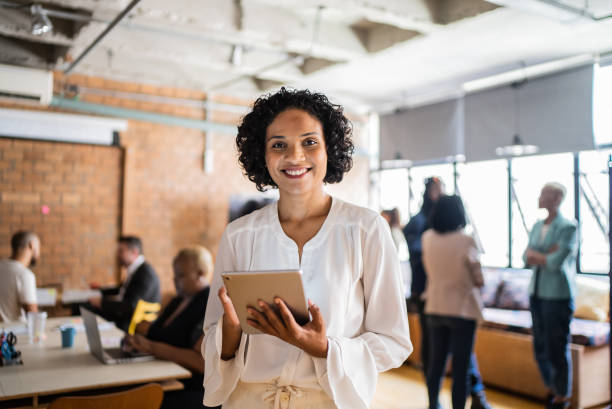 Portrait of a business woman using digital tablet in the office